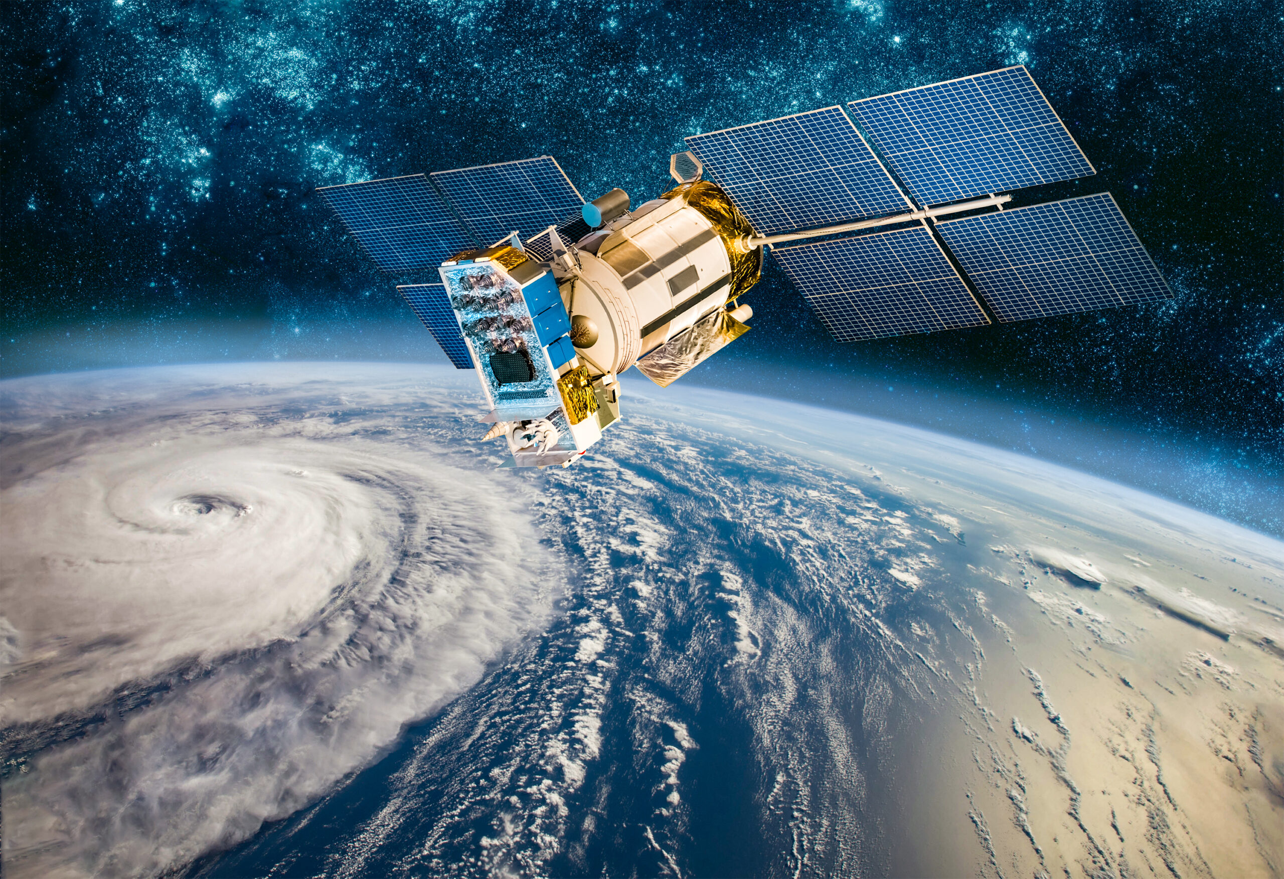 A satellite orbiting above Earth captures images of a swirling hurricane over a blue ocean, with the stars of space visible in the background.